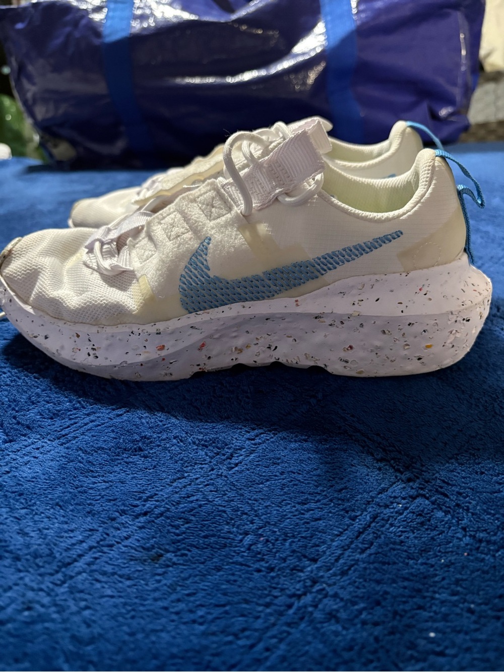 Nike Women’s Cream Sneakers with Light Blue Swoosh